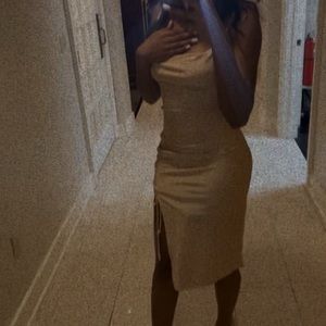 This is a tan fit it length adjustable mid dress.